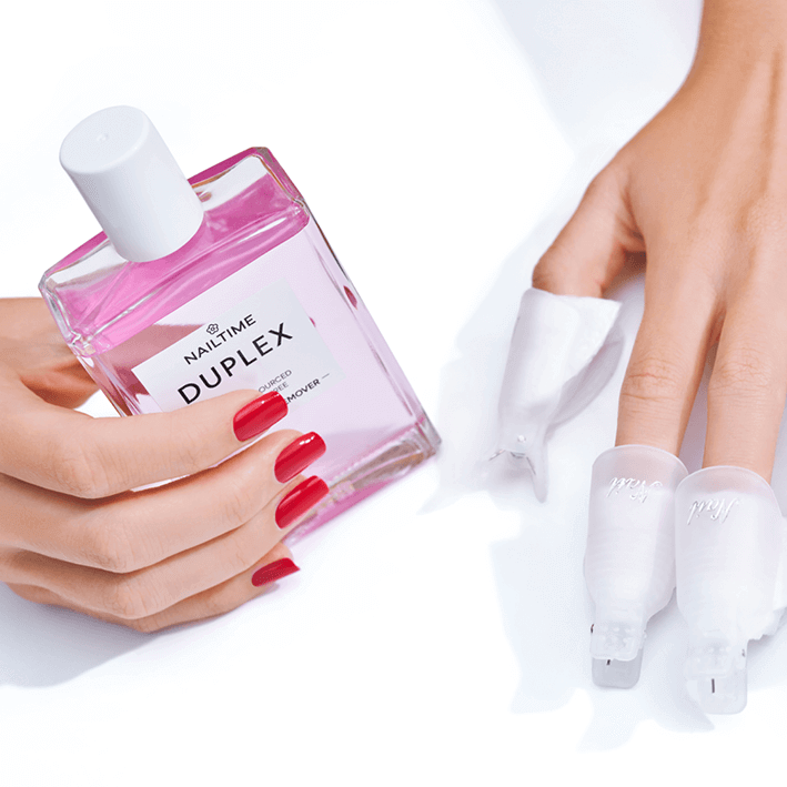DUPLEX Soft Nail Polish Remover in pink bottle for gentle UV polish removal, enriched with plant-based ingredients.