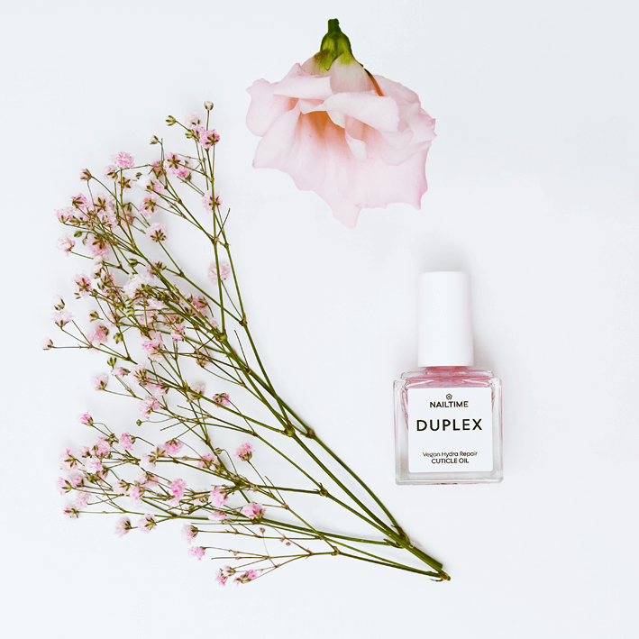 DUPLEX Hydra Repair Cuticle Oil 8ml with pink flowers, vegan and enriched with natural ingredients.
