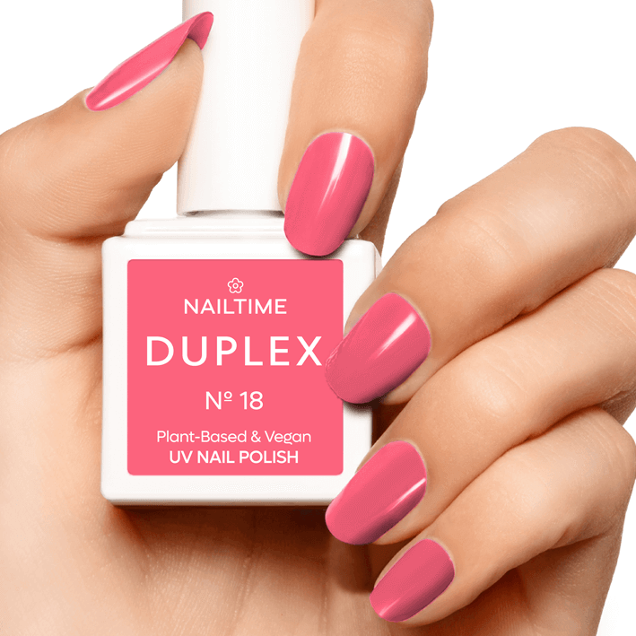 DUPLEX No.18 Awesome Apricot UV nail polish in a hand, showcasing plant-based and vegan formula.
