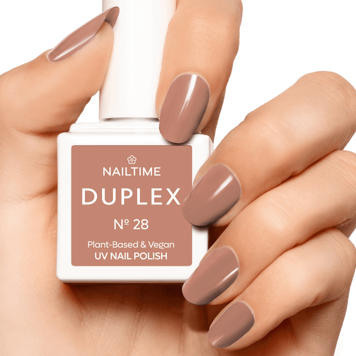 DUPLEX No.28 Chiffon UV Nail Polish, vegan and plant-based, shown on hand with neutral nude-beige color.