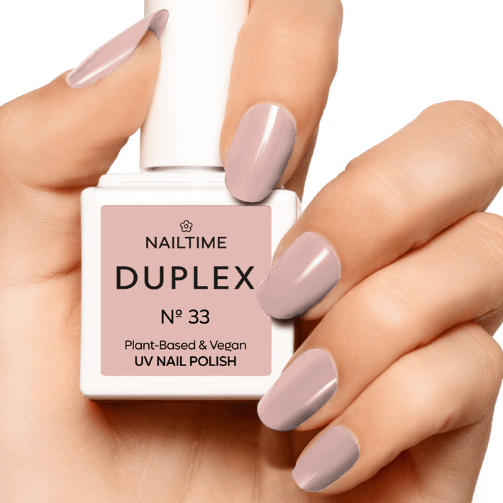 DUPLEX No.33 Peace Of Mind UV nail polish in plant-based, vegan formula, showcasing a delicate rose-beige shade on nails.