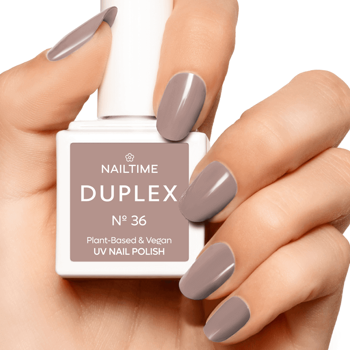 DUPLEX No.36 Chill Out plant-based vegan UV nail polish in elegant caramel tone on well-manicured hand.