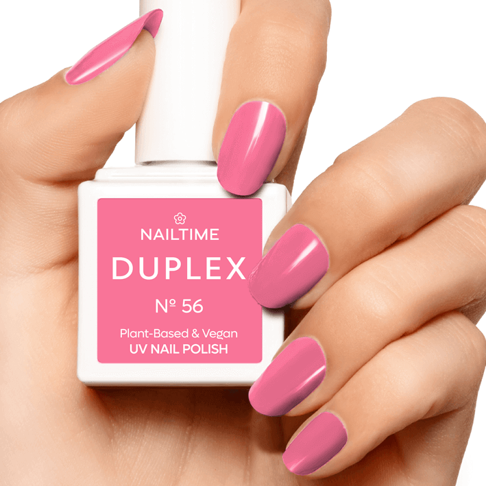 DUPLEX No.56 Flower Power UV nail polish in pastel pink on manicured nails, plant-based, vegan formula.