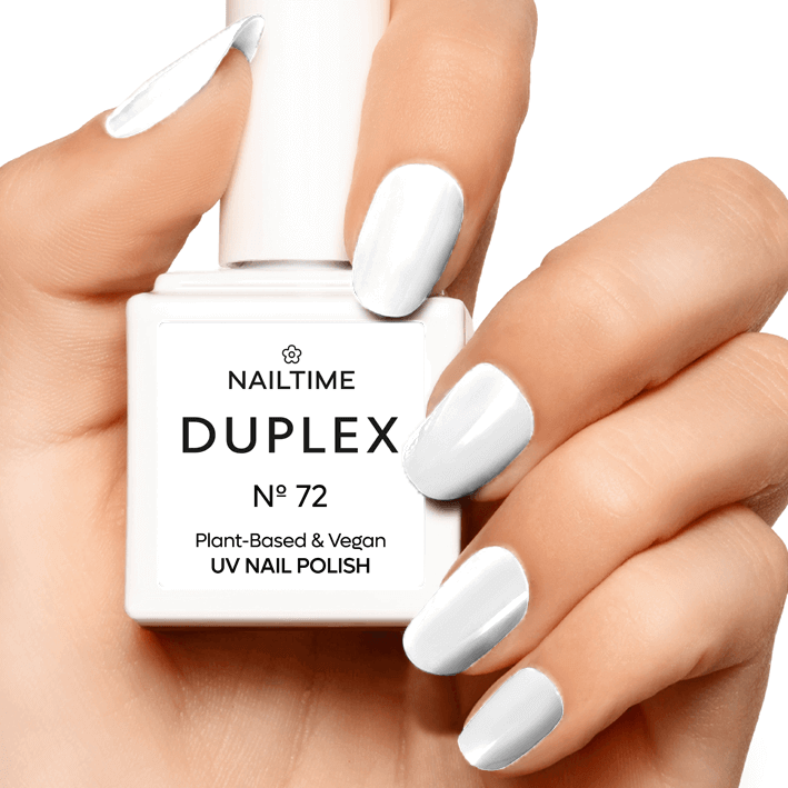 DUPLEX No.72 UV nail polish in bright polar white, plant-based and vegan, shown on manicured hand.