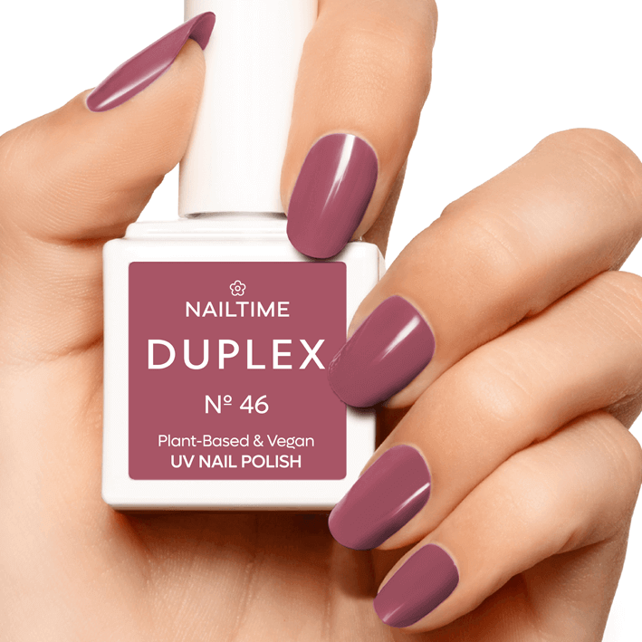 DUPLEX No.46 Funky Weekend vegan plant-based UV nail polish in dark berry red on manicured nails.
