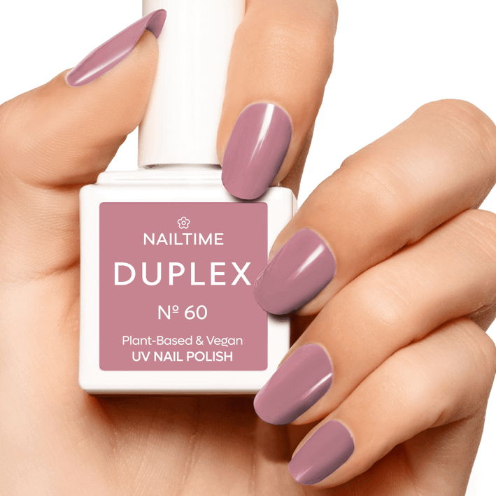 DUPLEX No.60 Powdery Room UV nail polish in a hand with elegant rosy nude manicure, plant-based and vegan formula.