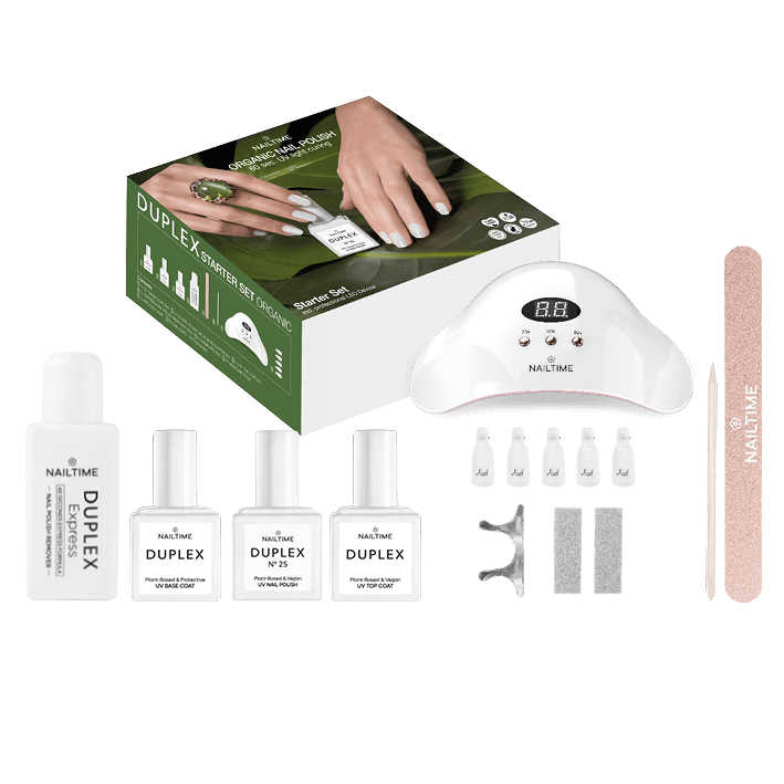 DUPLEX STARTER SET DELUXE with UV LED lamp, nail polish bottles, and accessories for professional DIY manicures.