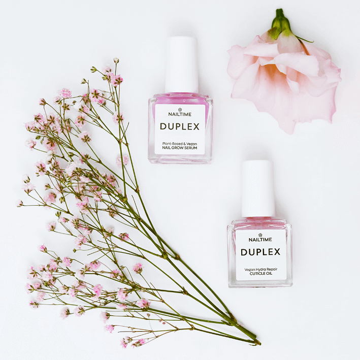 DUPLEX Nail Care Set featuring Nail Growth Serum and Cuticle Oil with pink flowers on a white background.