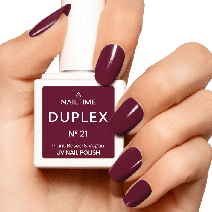 DUPLEX No.21 Miracle UV plant-based nail polish in rich raspberry red applied on nails.